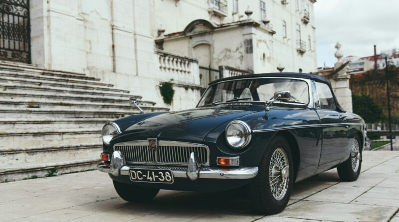 blue coupe near gray concrete staircase